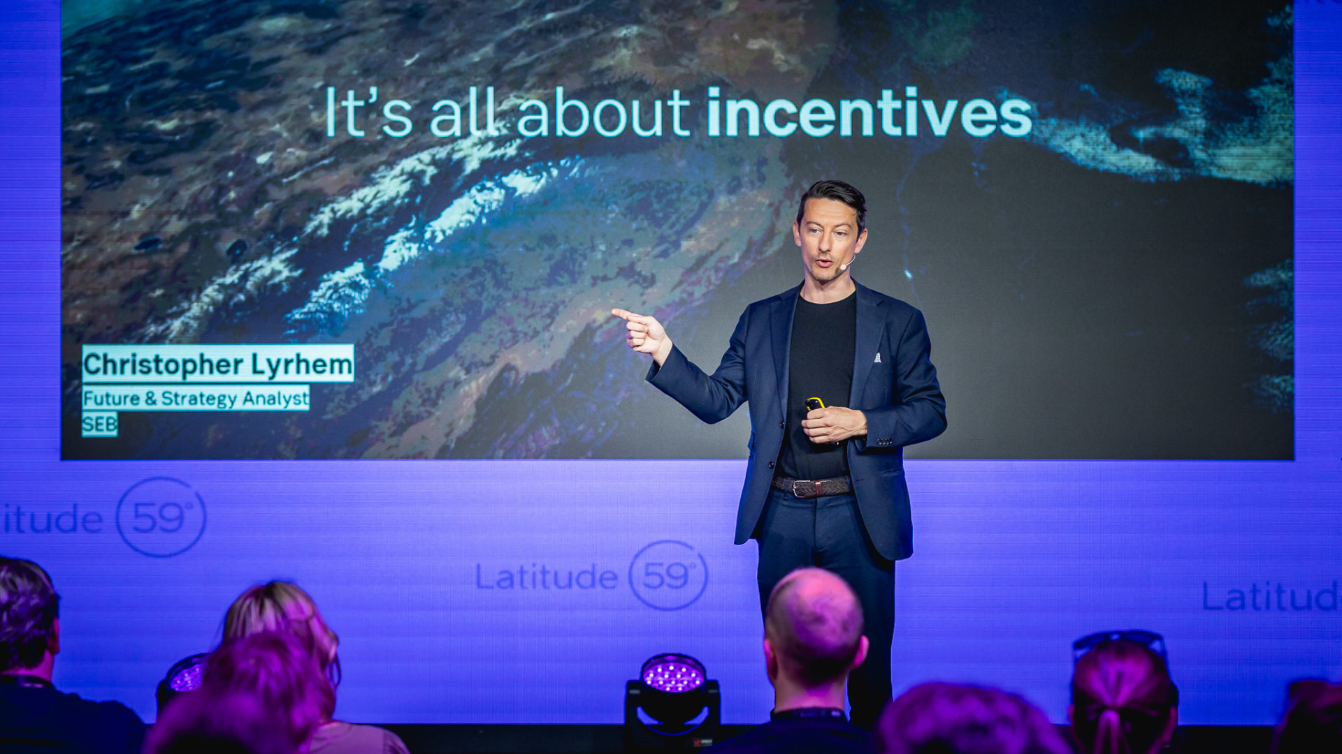 Christopher Lyrhem speaking on stage at Latitude 59