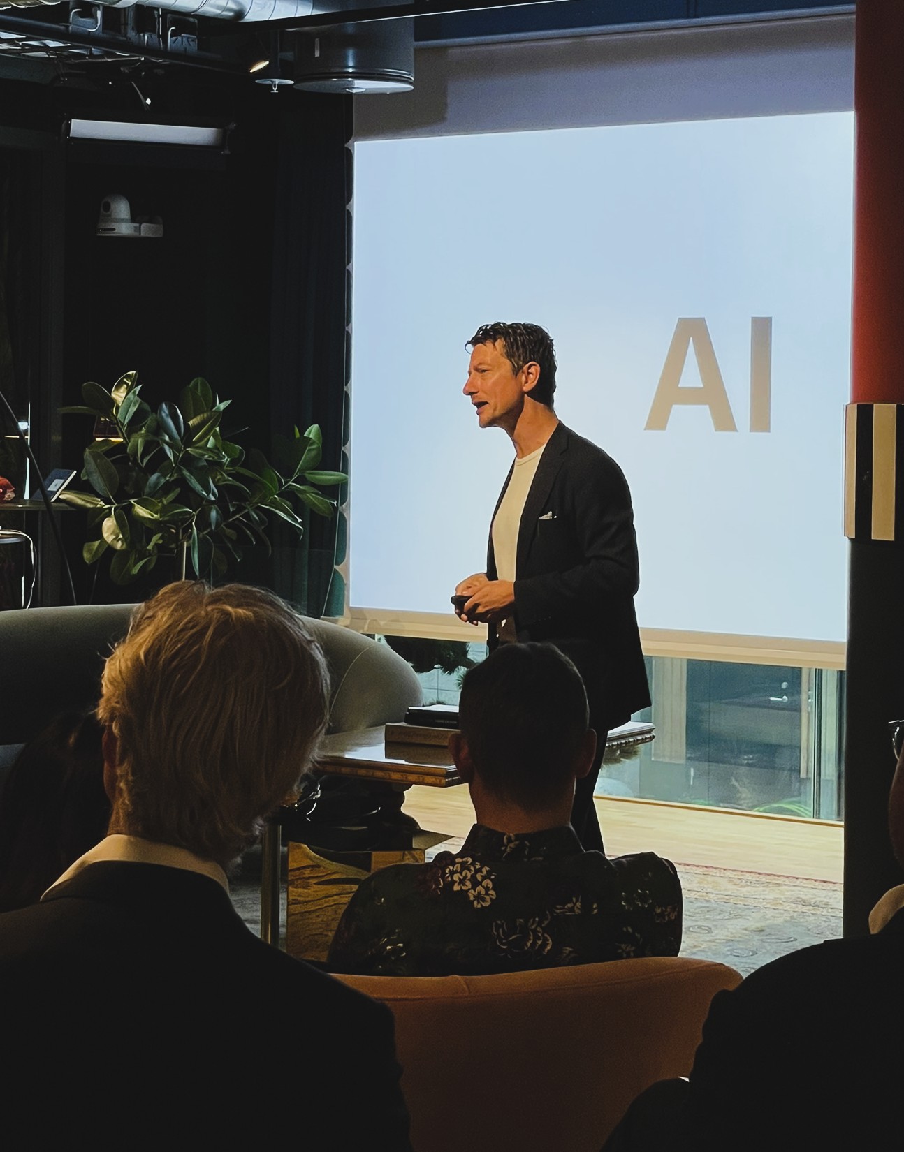 Christopher Lyrhem leading an AI session for a seated audience