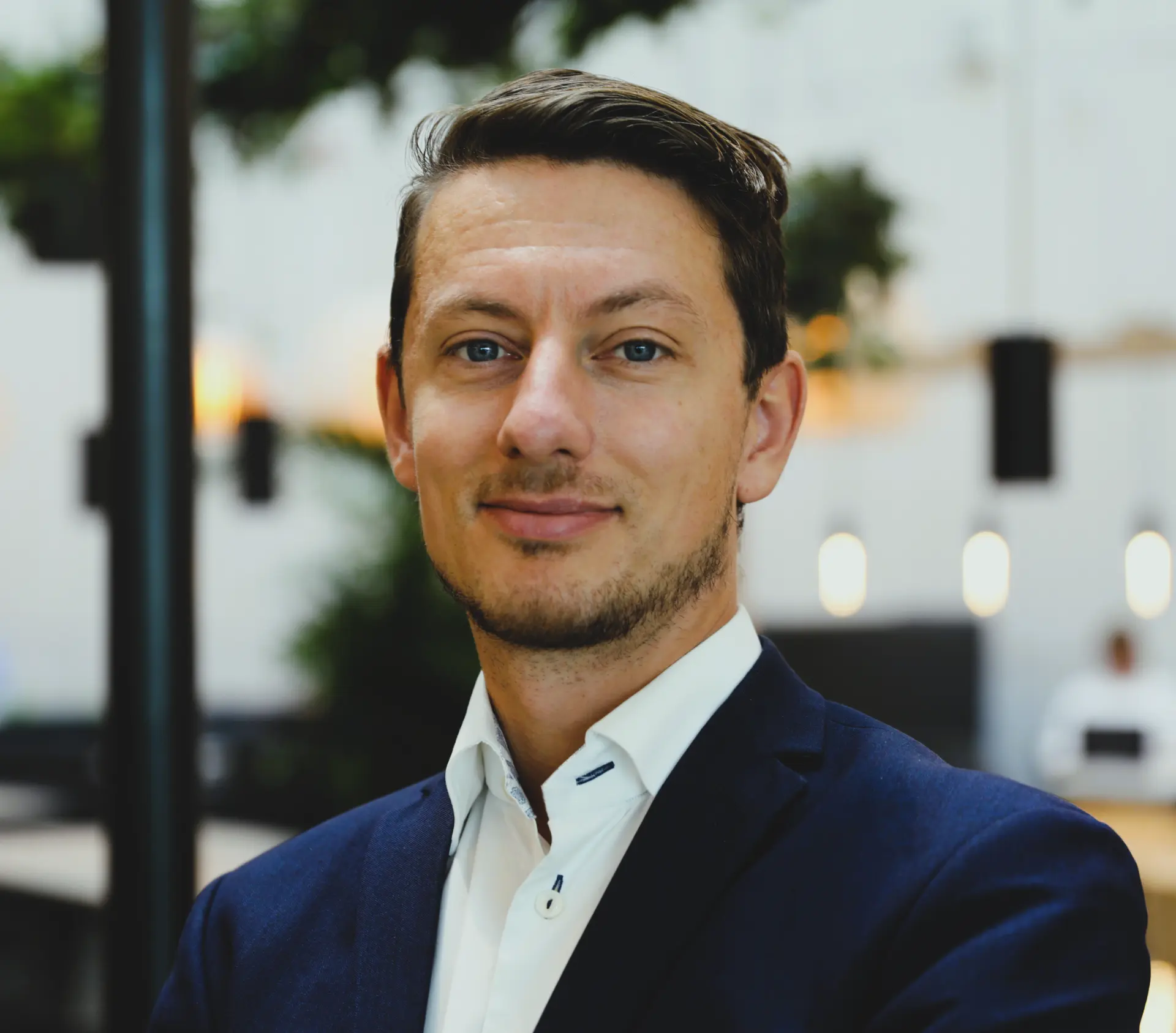 Christopher Lyrhem in a navy blazer